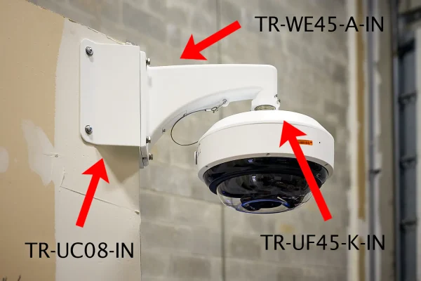 A Uniview Multi-Sensor Dome mounted in a warehouse with corner mount brackets